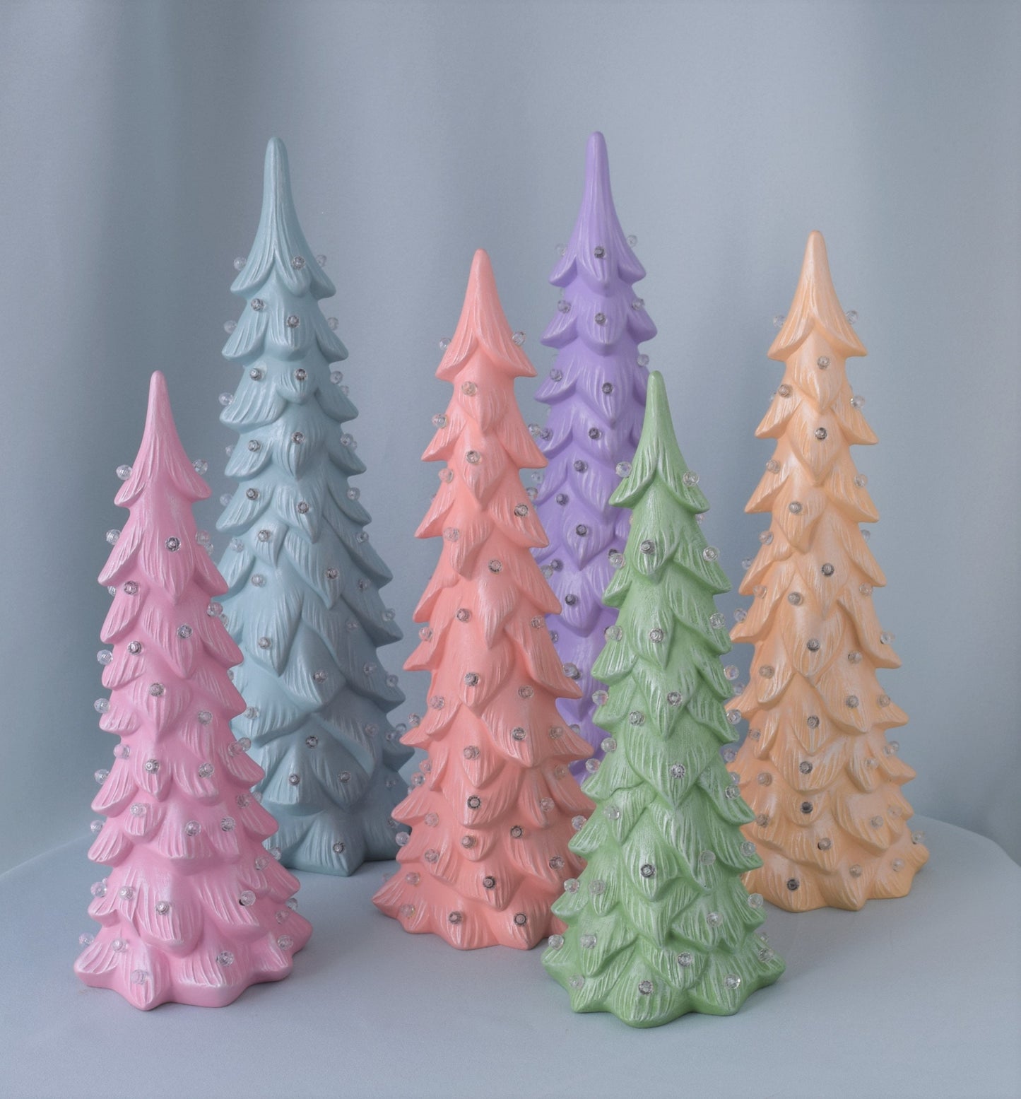 pastel colored ceramic wispy pine trees