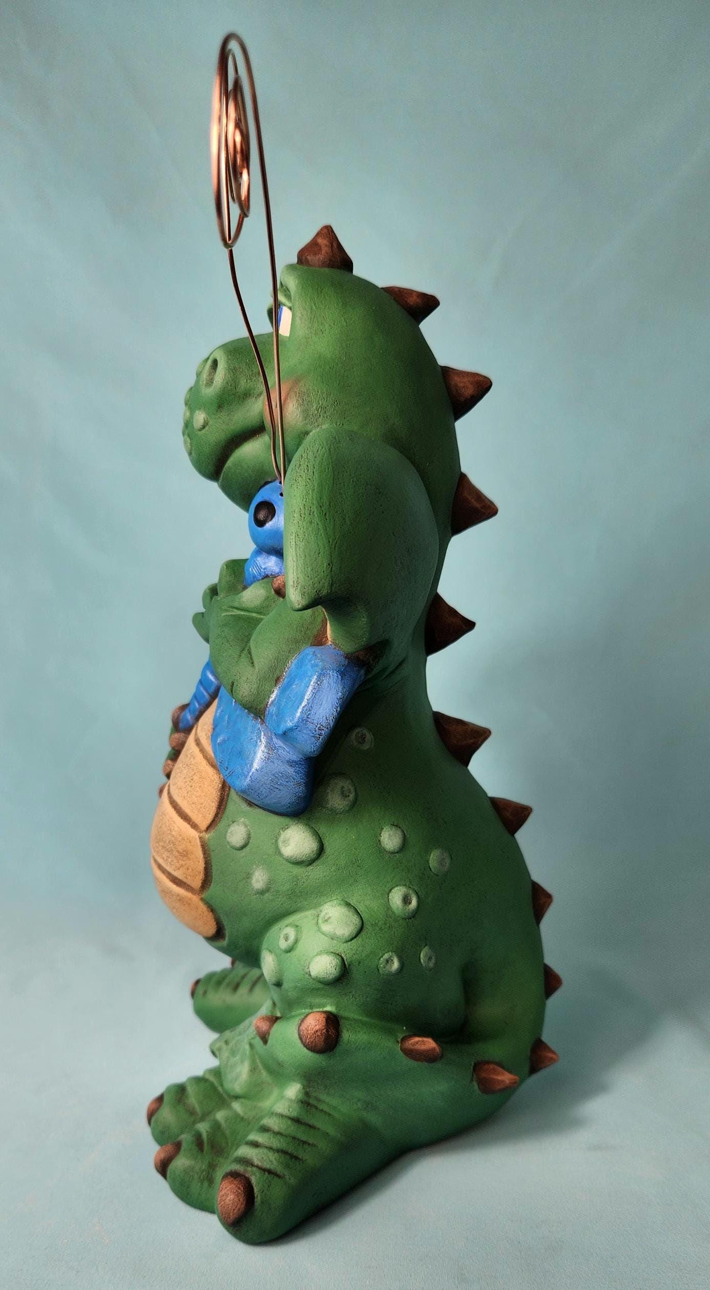 Silly Dragon holding a dragon fly