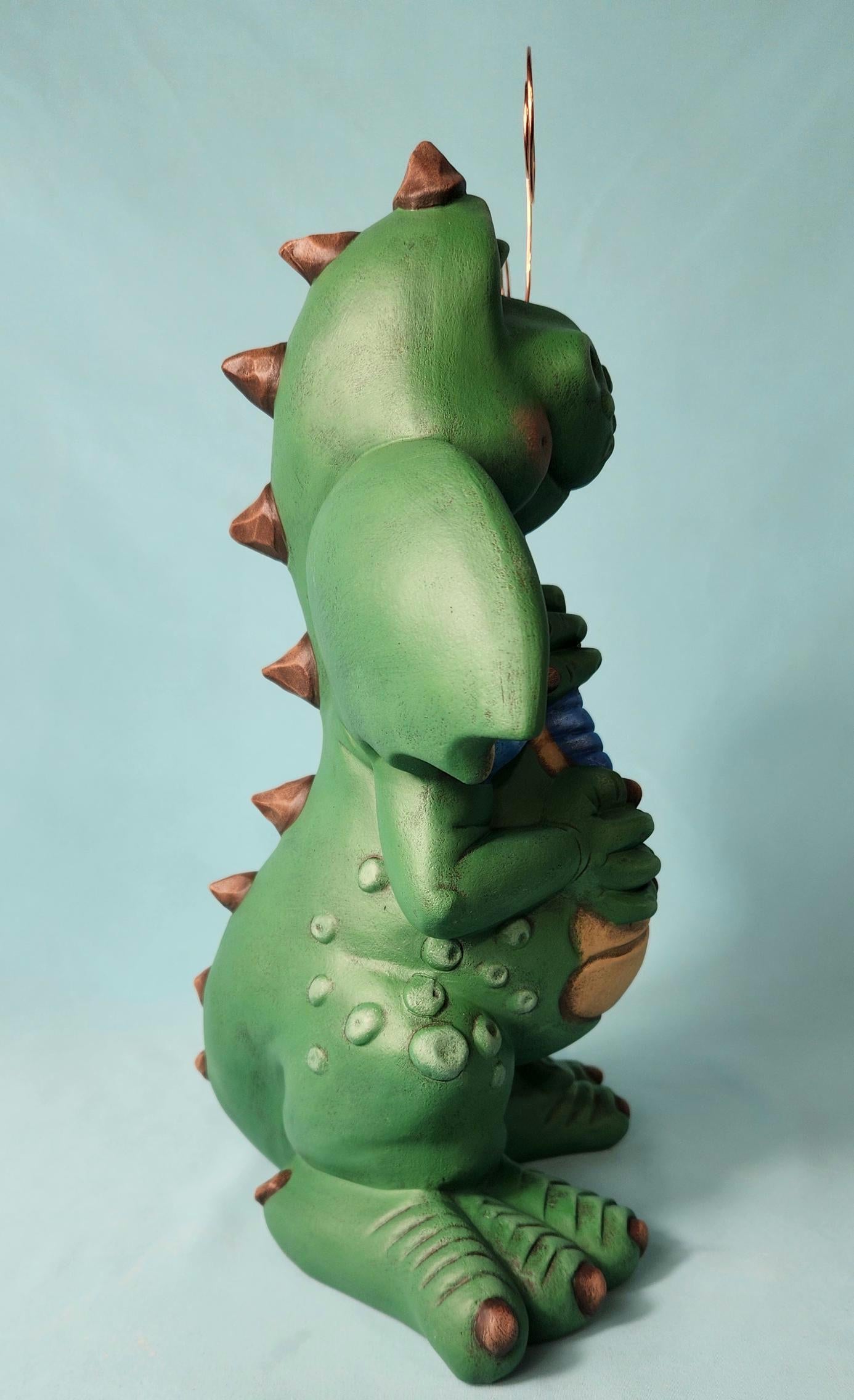 Silly Dragon holding a dragon fly