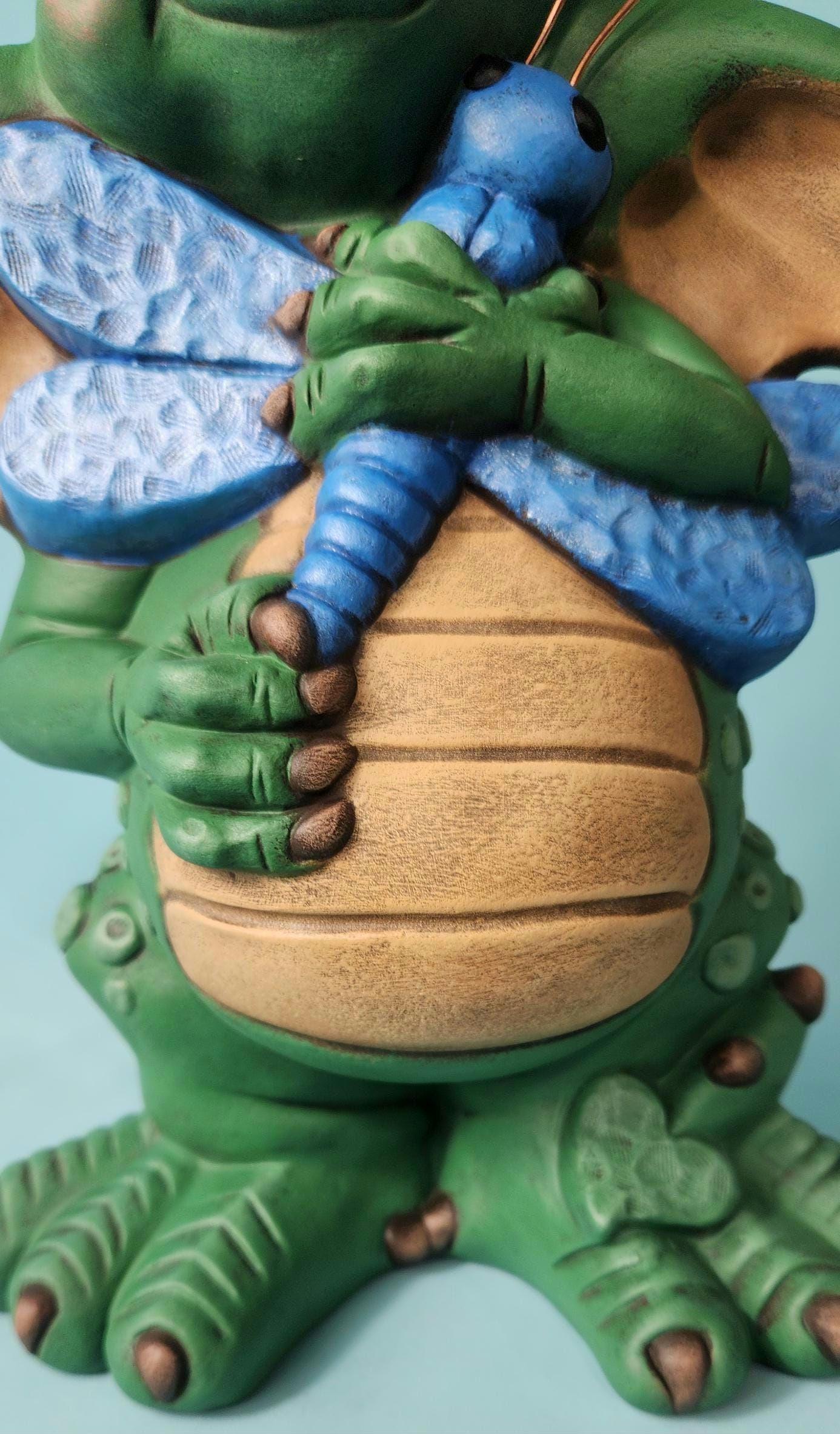 Silly Dragon holding a dragon fly