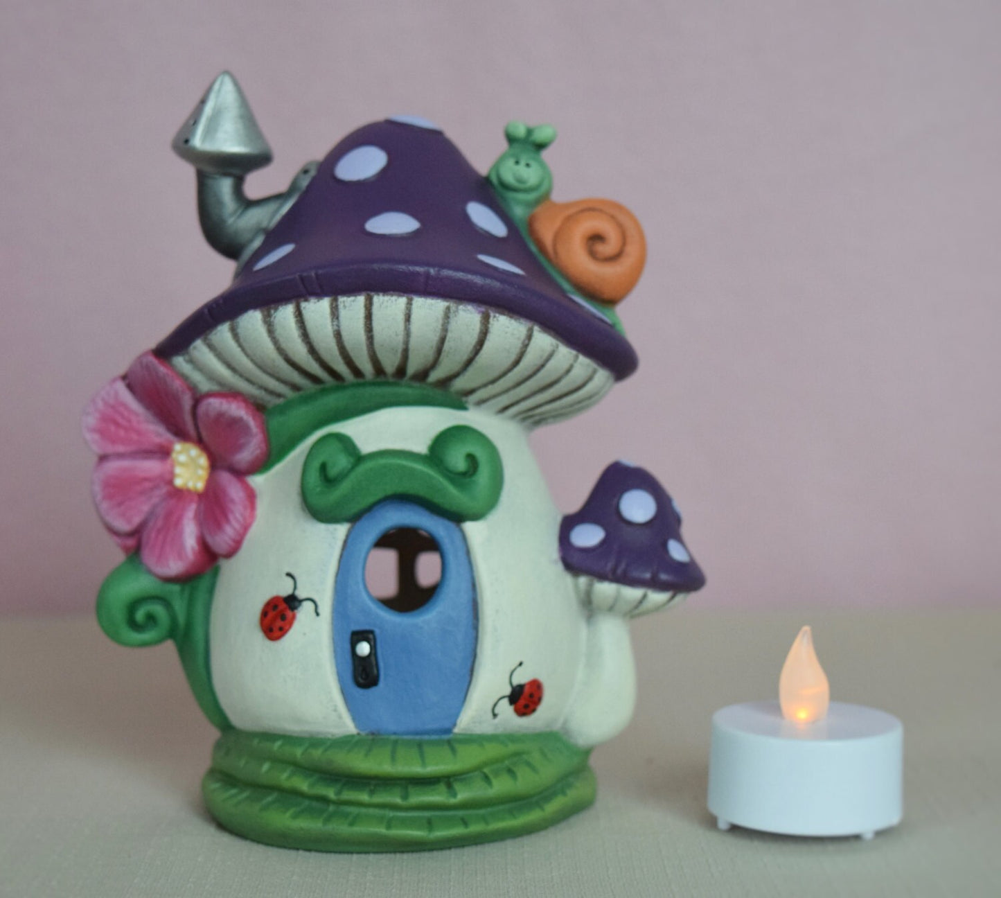 Enchanting Polka Dot Mushroom Fairy House: Illuminated Purple Snail Garden Decor with Tea Light Holder - Teresa's Ceramics
